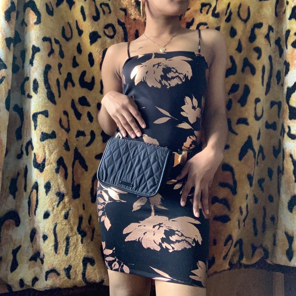 Bodycon party dress with copper detailing.